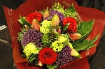 Bouquet of red naomi roses, purple trachelium, viburnum snowball and deep pink Oriental Lilies, mixed with foliage